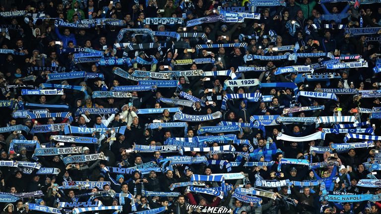 Napoli's supporters cheer during the UEFA Champions League football match SSC Napoli vs Real Madrid on March 7, 2017 at the San Paolo stadium in Naples. / 