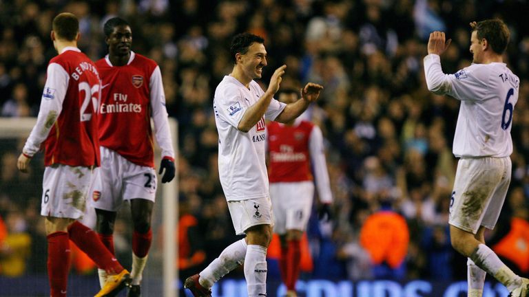 Tottenham's Steed Malbranque (C) celebrates with team mate Teemu Tanio (R) as Arsenal players, Danish Striker Nicklas Bendtner and Togo Striker Emmanuel Ad