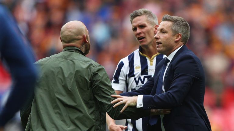 LONDON, ENGLAND - MAY 20:  Winning goalscorer Steve Morison of Millwall and Neil Harris manager of Millwall instruct invading Millwall fans to leave the pi