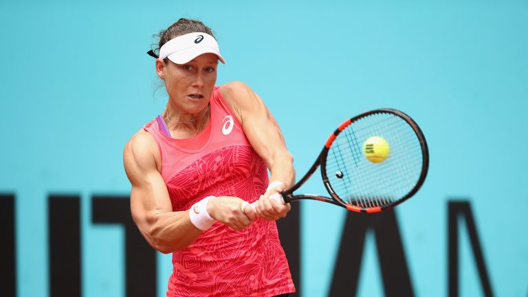 MADRID, SPAIN - MAY 10:  Samantha Stosur of Australia plays a backhand in her match against Simona Halep of Romania during day five of the Mutua Madrid Ope