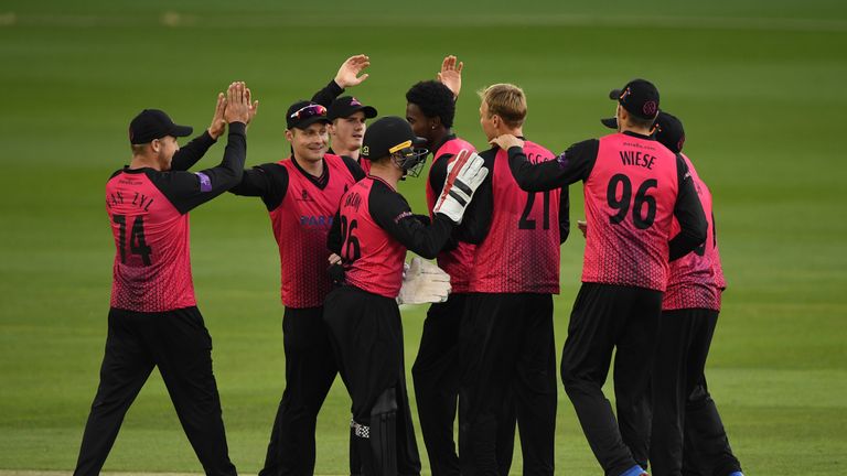 Sussex captain Luke Wright (2nd L) is congratulated by team mates after taking the catch to dismiss Jacques Rudolph