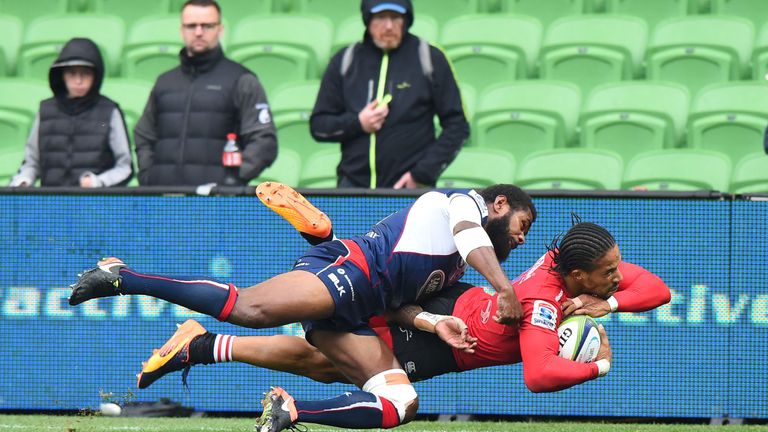 Lions plaer Sylvian Mahuza reacts after being tackled by Marika Koroibete and missing a try during the Super Rugby match between the Melbourne Rebels and G