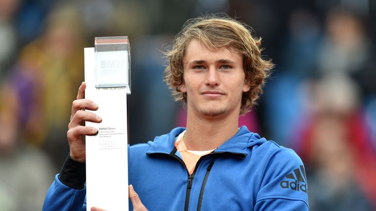 German Alexander Zverev holds the winner trophy during the winner ceremony after his final match against Argentinian Guido Pella at the ATP tennis BMW Open