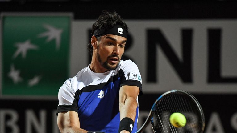 Italy's Fabio Fognini returns the ball to Britain's Andy Murray during their Rome ATP Tennis Open tournament match