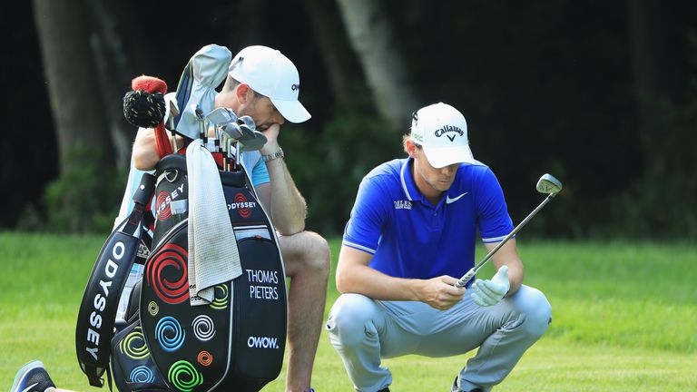 VIRGINIA WATER, ENGLAND - MAY 25: Thomas Pieters of Belgium waits with caddie Adam Marrow on the 16th hole during day one of the BMW PGA Championship at We