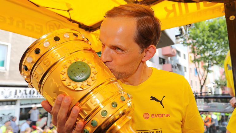 Thomas Tuchel kisses the DFB Cup during celebrations at Borsigplatz