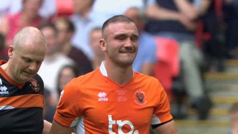 Blackpool captain Tom Aldred suffered a match-ending injury at Wembley and was in tears as he left the pitch. 
