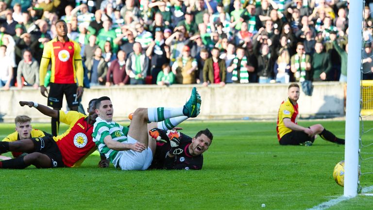 Tom Rogic (seated) puts Celtic 2-0 in front at Firhill