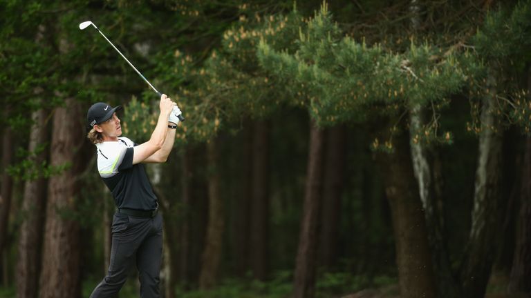 VIRGINIA WATER, ENGLAND - MAY 24:  Tommy Fleetwood of England hits an iron during day 4 of the BMW PGA Championship at Wentworth on May 24, 2015 in Virgini