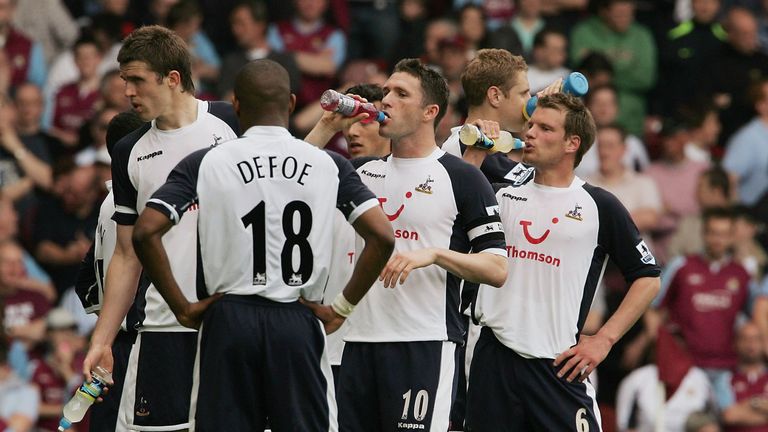 Tottenham players take on fluids during the game at Upton Park