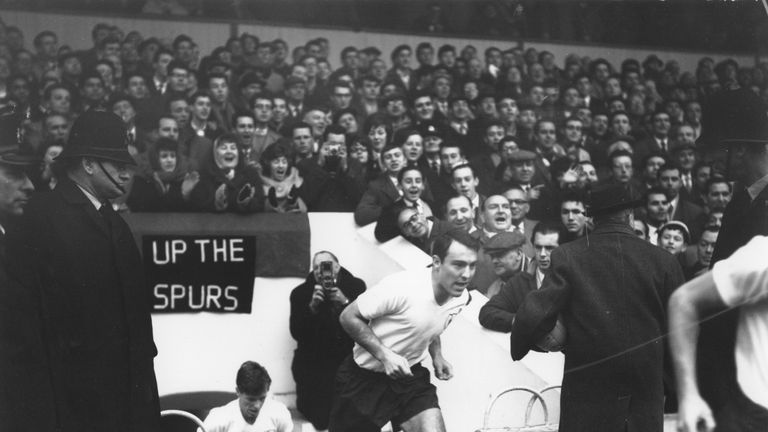 15 DEC 1961:  JIMMY GREAVES OF TOTTENHAM HOTSPUR RUNS ON TO THE FIELD TO CHEERS FROM THE CROWD BEFORE THE START OF THE MATCH AGAINST BLACKPOOL AT WHITE HAR