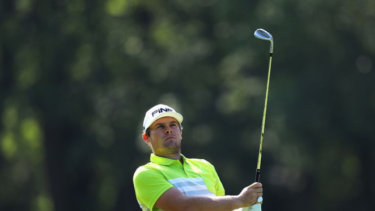 VIRGINIA WATER, ENGLAND - MAY 25:  Tyrrell Hatton of England plays his second shot on the 6th hole during day one of the BMW PGA Championship at Wentworth 