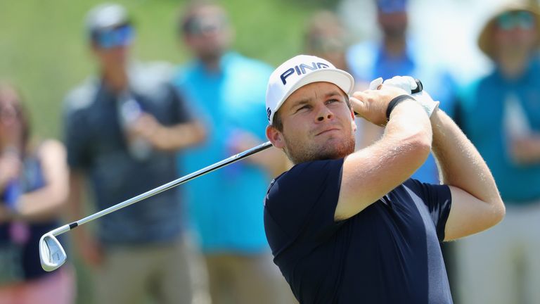 Tyrrell Hatton of England plays his shot from the third tee during the final round of THE PLAYERS Championship