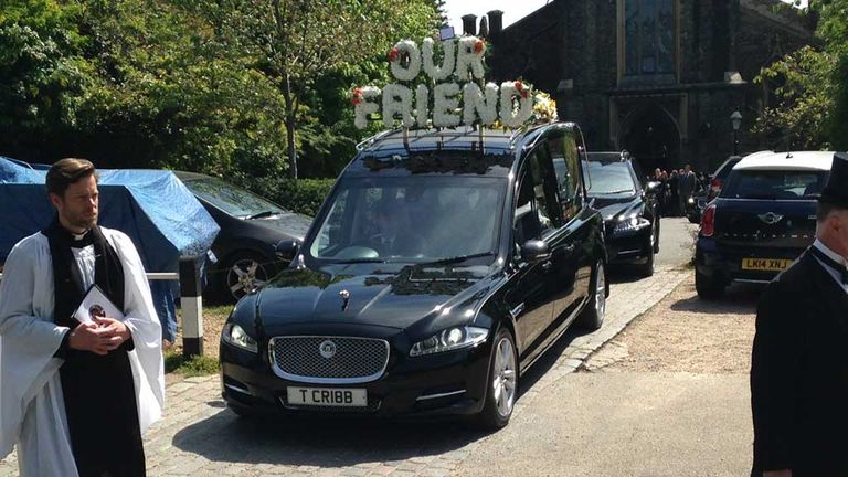 Ehiogu's hearse leaves the church in Highgate, London 