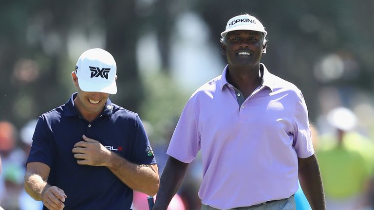 Billy Horschel of the United States and Vijay Singh of Fiji walk on the tenth hole during the second round of the THE PLAYERS Championship