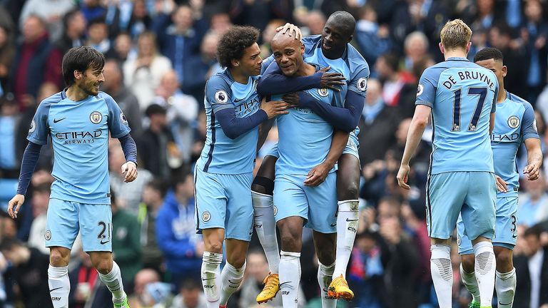Vincent Kompany celebrates with team-mates after doubling Manchester City's lead