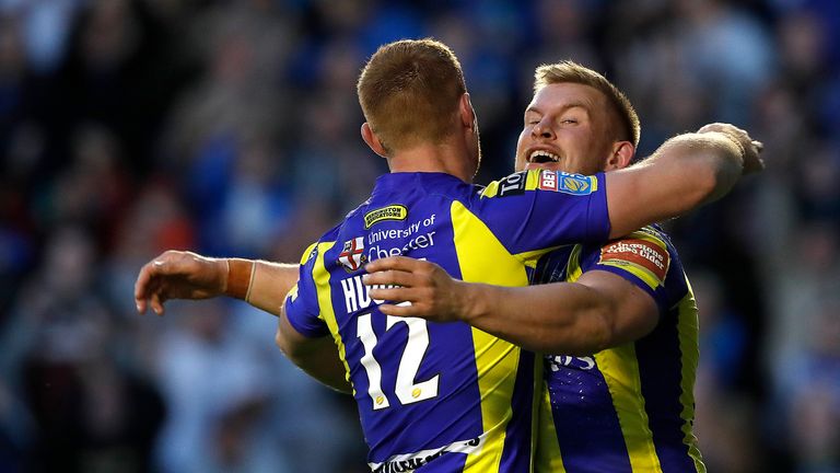 Warrington Wolves' Mike Cooper (right) celebrates his try against St Helens during the Betfred Super League match at the Halliwell Jones Stadium, Warringto