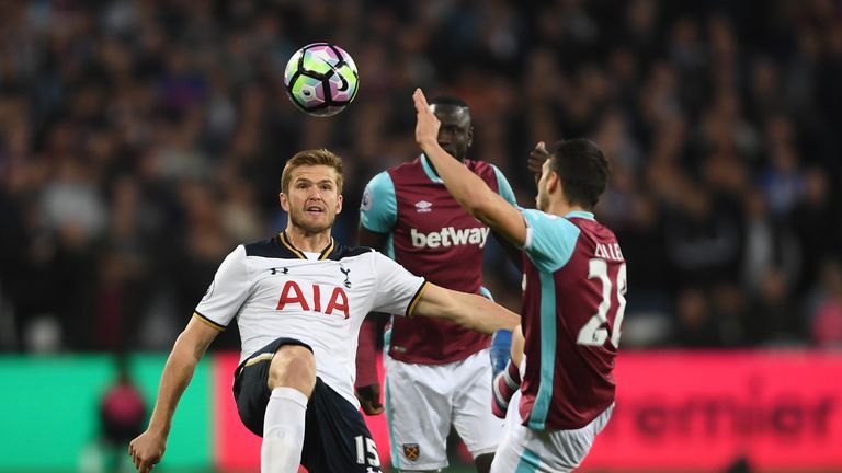 Eric Dier of Tottenham Hotspur and Jonathan Calleri of West Ham United compete for the ball during the Premier League match at London Stadium