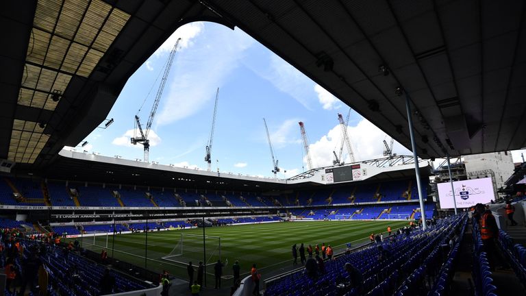 Cranes are seen above White Hart Lane in London, on May 14, 2017 ahead of the English Premier League football match between Tottenham Hotspur and Mancheste