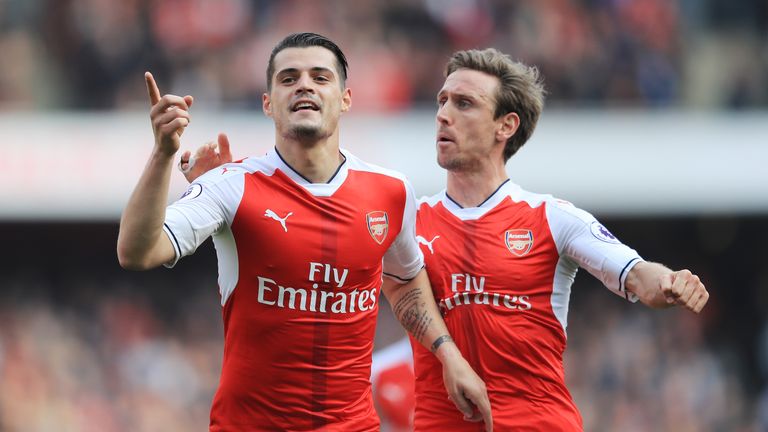 LONDON, ENGLAND - MAY 07: Granit Xhaka of Arsenal celebrates scoring his sides first goal with Nacho Monreal of Arsenal during the Premier League match bet