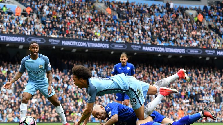 Leroy Sane is brought down in the box by Yohan Benalouane