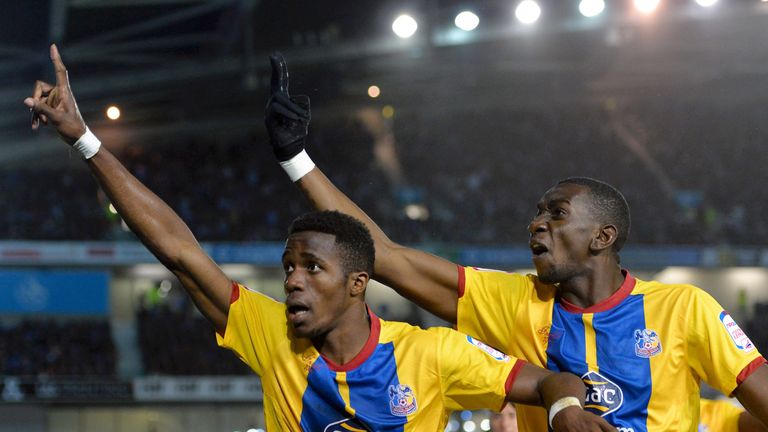 BRIGHTON, ENGLAND - MAY 13:  Wilfried Zaha of Crystal Palace celebrates with team-mate Yannick Bolasie after scoring his first goal during the npower Champ