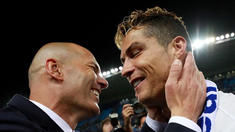Zinedine Zidane embraces Cristiano Ronaldo after Real Madrdid are crowned 2016/17 La Liga champions