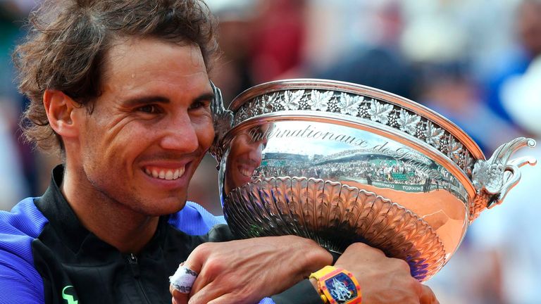 Nadal poses with the French Open trophy after beating Stan Wawrinka at Roland Garros