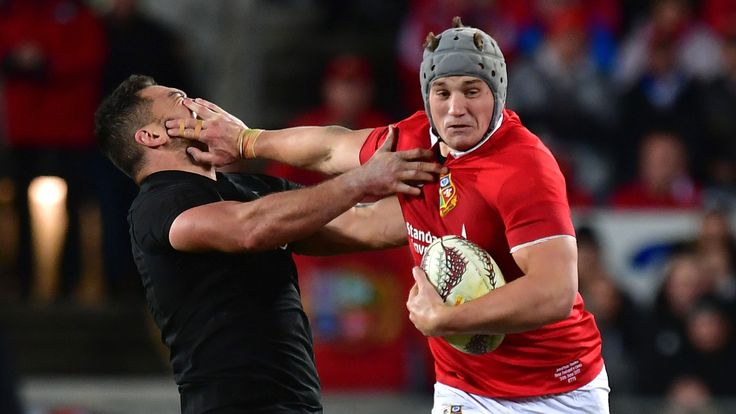 1st Test, Eden Park, Auckland, 24/6/2017. All Blacks vs British & Irish Lions. Lions' Jonathan Davies hands off Codie Taylor of the All Blacks