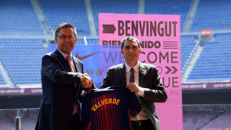 Barcelona's new coach shakes hands with Barcelona's president Josep Maria Bartomeu