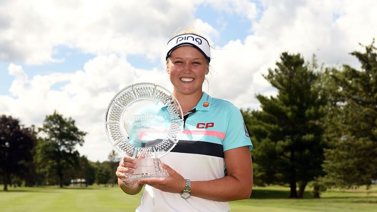 Brooke Henderson with the spoils of victory