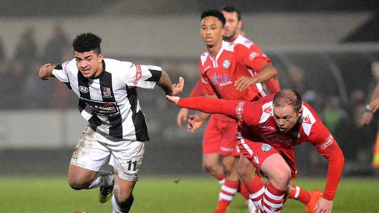 Leicester City's Josh Gordon in action for Stafford Rangers  as future Arsenal player Cohen Bramall looks on