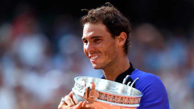 Spain's Rafael Nadal poses with his trophy after winning the men's final tennis match against Switzerland's Stanislas Wawrinka at the Roland Garros 2017 Fr