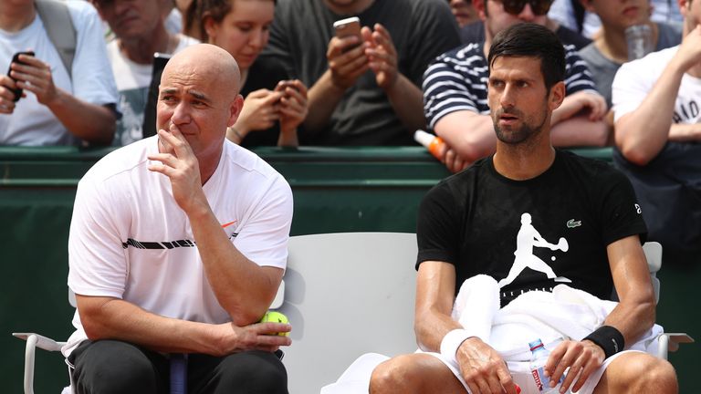 Novak Djokovic in discussion with coach Andre Agassi during the 2017 French Open at Roland Garros