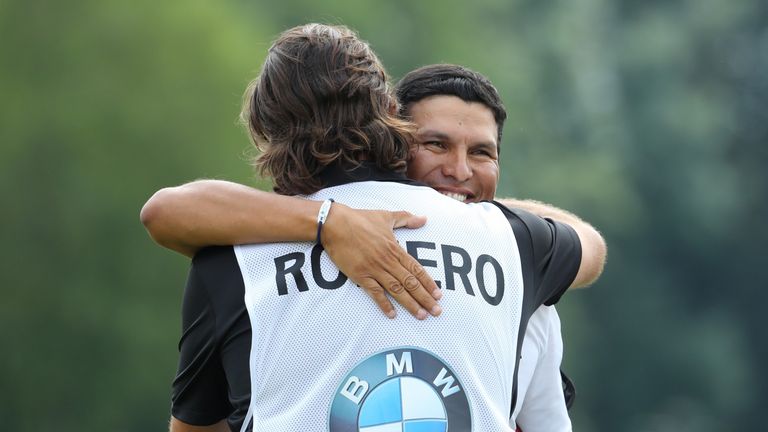 MUNICH, GERMANY - JUNE 25:  Andres Romero of Argentina embraces his caddie on the 18th green during the final round of the BMW International Open at Golfcl