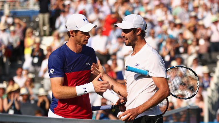 Jordan Thompson is congratulated by Andy Murray