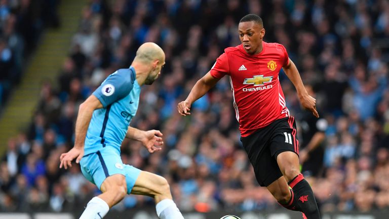 Anthony Martial looks for a way past Pablo Zabaleta during the Manchester derby at the Etihad Stadium