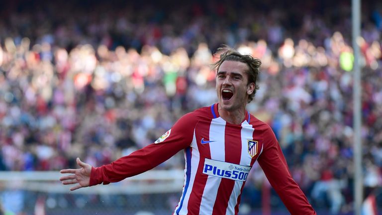 Atletico Madrid's French forward Antoine Griezmann celebrates after scoring during the Spanish league football match Club Atletico de Madrid vs Sevilla FC 