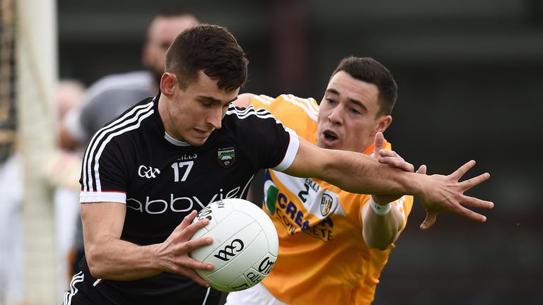 Niall Murphy of Sligo in action against Declan Lynch of Antrim