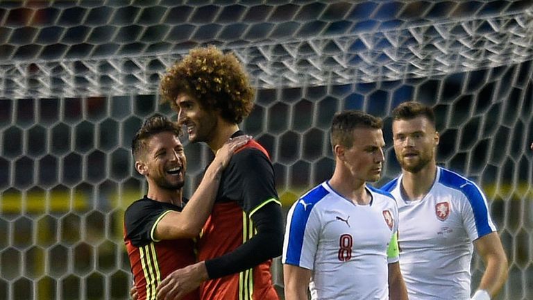 Belgium's midfielder Marouane Fellaini (C) celebrates after scoring during a friendly 