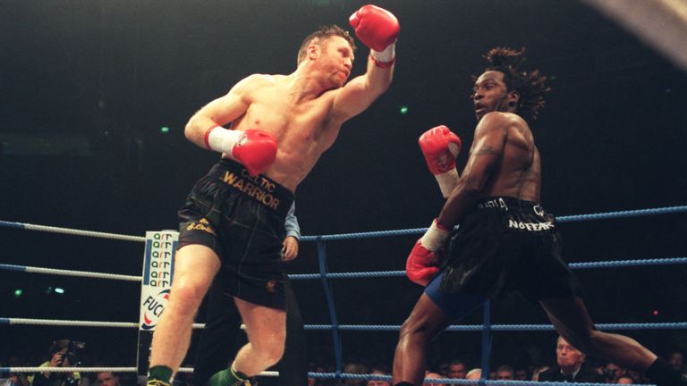 9 Nov 1996: Steve Collins of Ireland (left) swings and misses Nigel Benn, with a left hook, during the Benn v Collins rematch at the Nynex Arena in Manches
