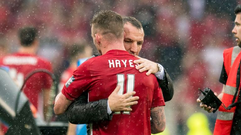 Jonny Hayes receives a consolatory hug from Brendan Rodgers after the Cup final