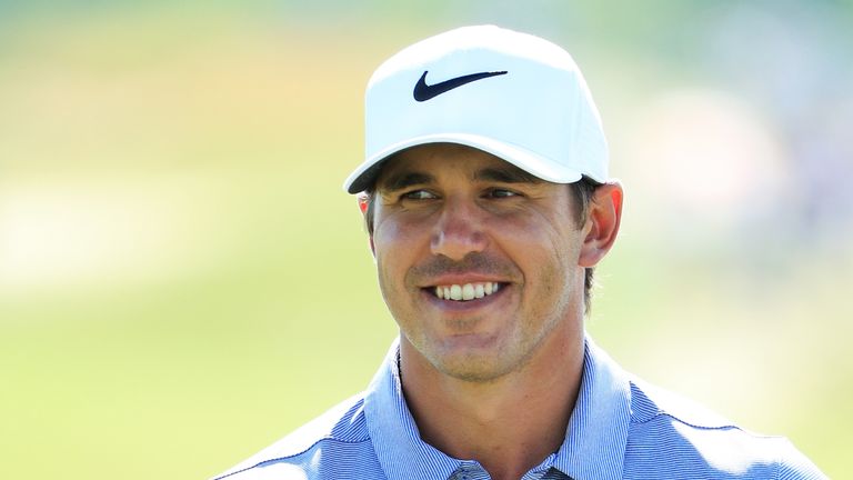 Brooks Koepka of the United States smiles whlie on the 18th green during the second round of the 2017 U.S. Open at Erin Hills