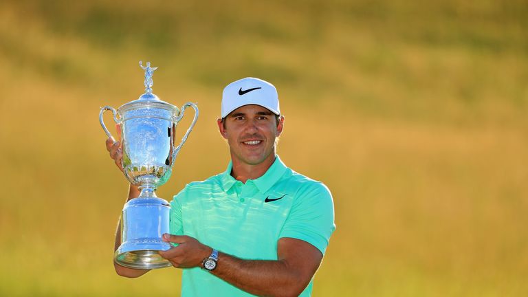 Brooks Koepka poses with the winner's trophy after his victory at the US Open