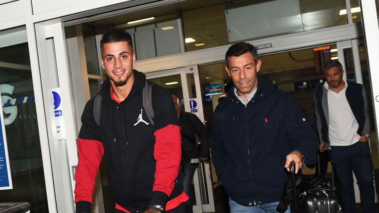 Rangers target Fabio Cardoso (L) arrives into Glasgow with Rangers manager Pedro Caixinha