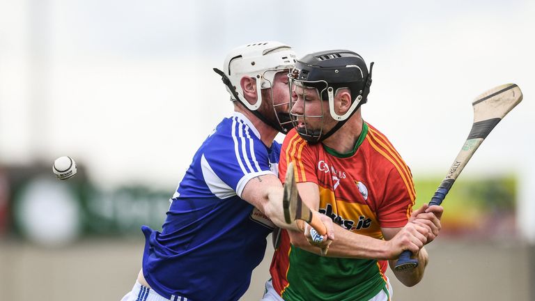 Richard Kelly of Carlow is tackled by Neil Foyle of Laois during the GAA Hurling All-Ireland Senior Championship Preliminary Round match