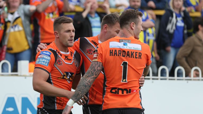 Castleford Tigers celebrate scoring their second try against Warrington