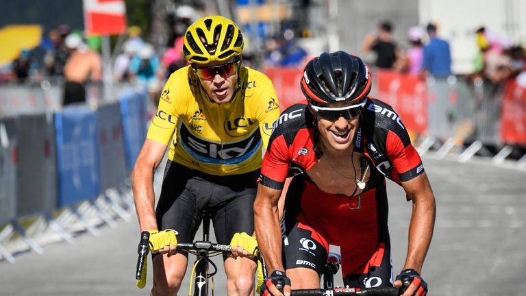 Australia's Richie Porte (R) rides ahead of Great Britain's Christopher Froome, wearing the overall leader's yellow jersey, during the 184,5 km seventeenth