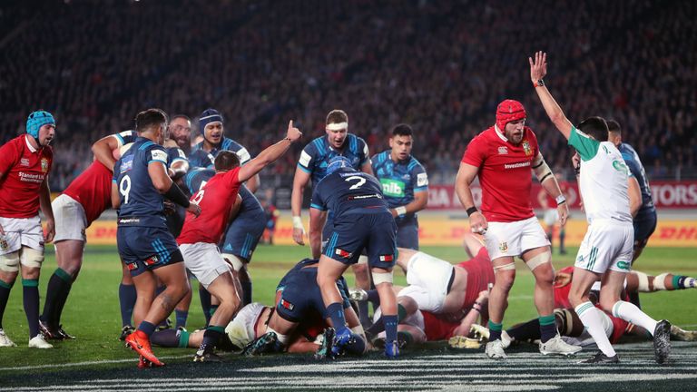 British and Irish Lions' CJ Stander (obscured) scores his side's first try during the tour match at Eden Park, Auckland.