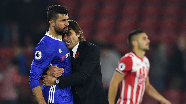 Chelsea's Italian head coach Antonio Conte (2nd L) embraces Chelsea's Brazilian-born Spanish striker Diego Costa (L) after the English P